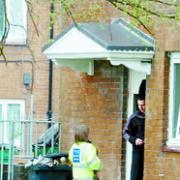 BLAZE PROBE: Police and fire crews at the flat in Carlinghurst Road, Blackburn,