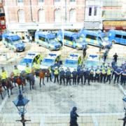 SHOW OF FORCE: Police gather outside Blackburn Town Hall for a briefing