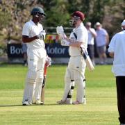 Cherry Tree CC batters Timycen Maruma and Jack Kennedy chat during their match at Whalley CC.