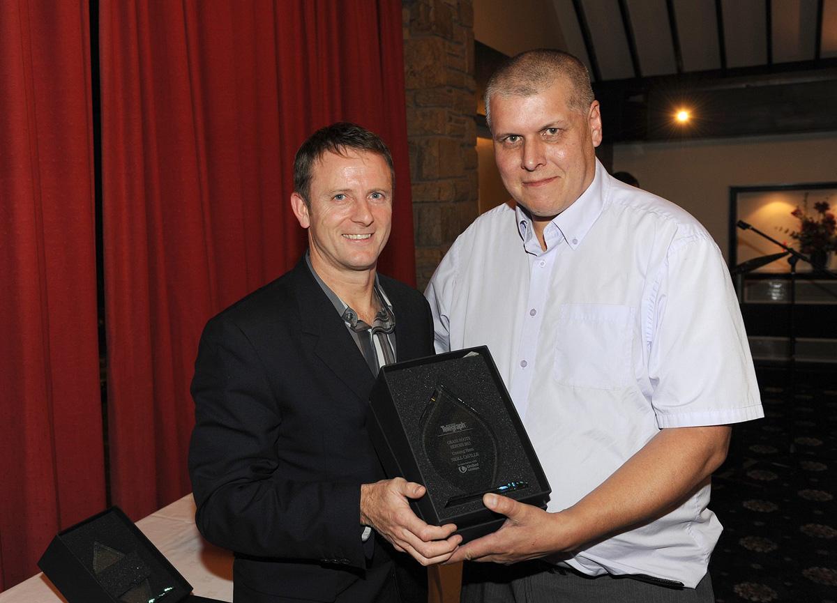 Kevin Gallacher presents Neill Caville with the Unsung Hero Award, during the Grassroots Awards 2011.
