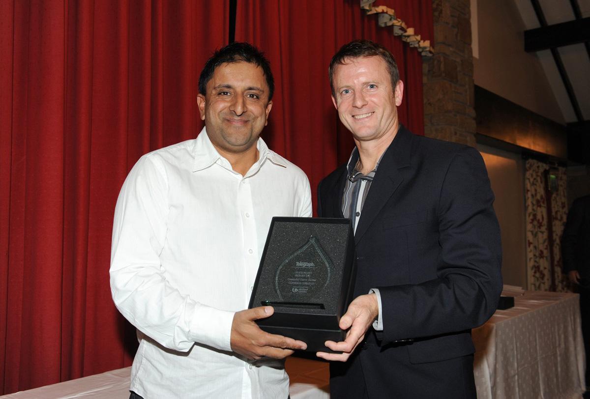 Kevin Gallacher of Blackburn Rovers presents Farouk Hussain of Clitheroe Cobras Cricket Club with the Community Club of the Year, during the Grassroots Awards.