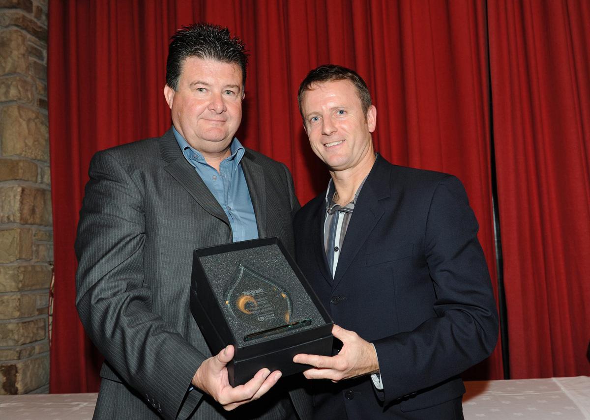 Kevin Gallacher of Blackburn Rovers presents Stan Heaton of Lowerhouse Cricket Club with the Peoples Choice Award, during the Grassroots Awards 2011.