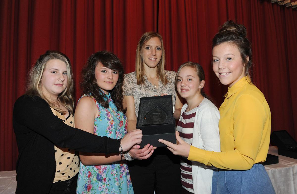 Laura Massaro (centre) presents L/R Amber Kenyon, Neeve Hulton, Megan Hester and Freya Knowles of the St Bedes Under 13's Girls Football Team with the Performance of the Year Award, during the Grassroots Awards 2011. 