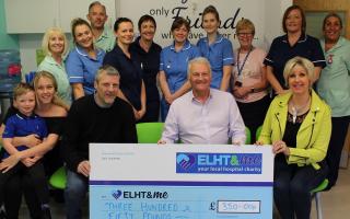 Pictured: Andy Laraway, his family and local landlord Brian Healey, present their donation to staff on the Chemotherapy Ward at the Royal Blackburn Hospital.