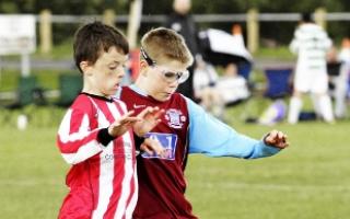 EYES DOWN: Blackburn Eagles U12s and Leyland Albion U12s players tussle for the ball