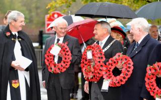 Ribble Valley Mayor Michael Ranson and wreath layers, and a youngster in Earby