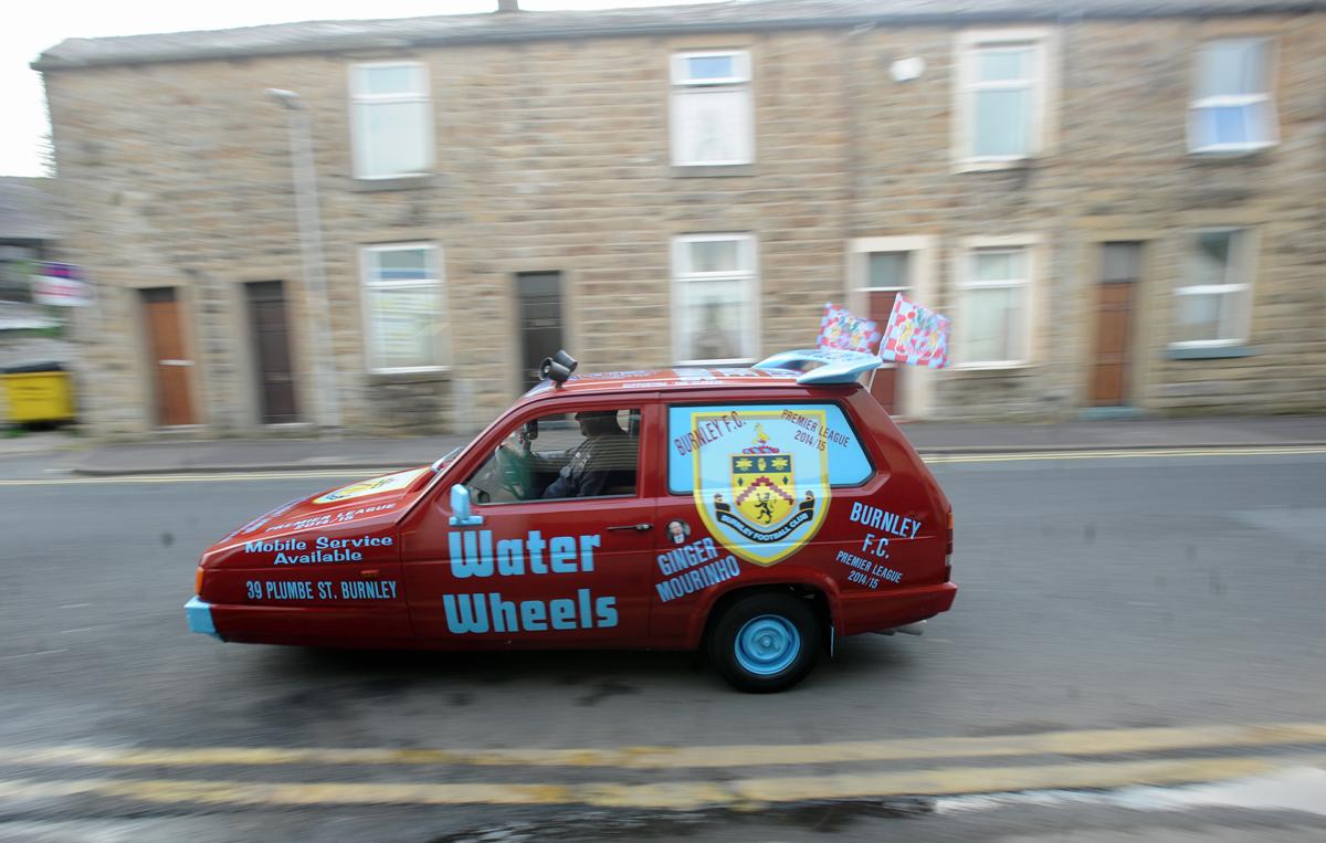 Mark Holmes from Water Wheels Valeting on Plumbe Street in Burnley has done up his claret and blue Robin Reliant for this season to celebrate Burnley being in the premiership