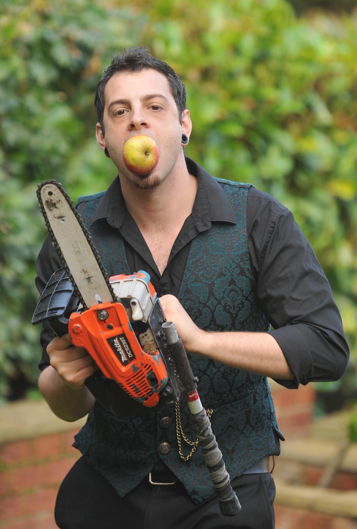 Extreme Showman Johnny Strange, chainsaw's, swords fire and of course apples.