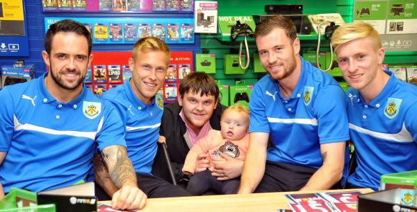 Burnley FC players Danny Ings, Ben Mee, Ashley Barnes and Scott Arfield sign copies of FIFA '15 at GAME, Burnley