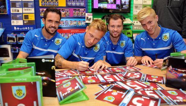 Burnley FC players Danny Ings, Ben Mee, Ashley Barnes and Scott Arfield sign copies of FIFA '15 at GAME, Burnley