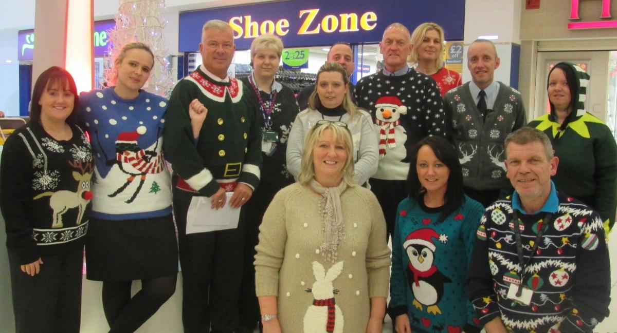 Team members from the Mall in Blackburn wearing their Christmas jumpers