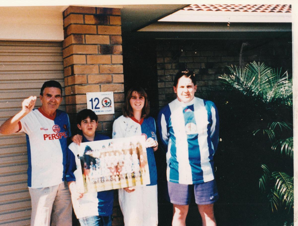 G. Farnworth and family outside their home in Australia.