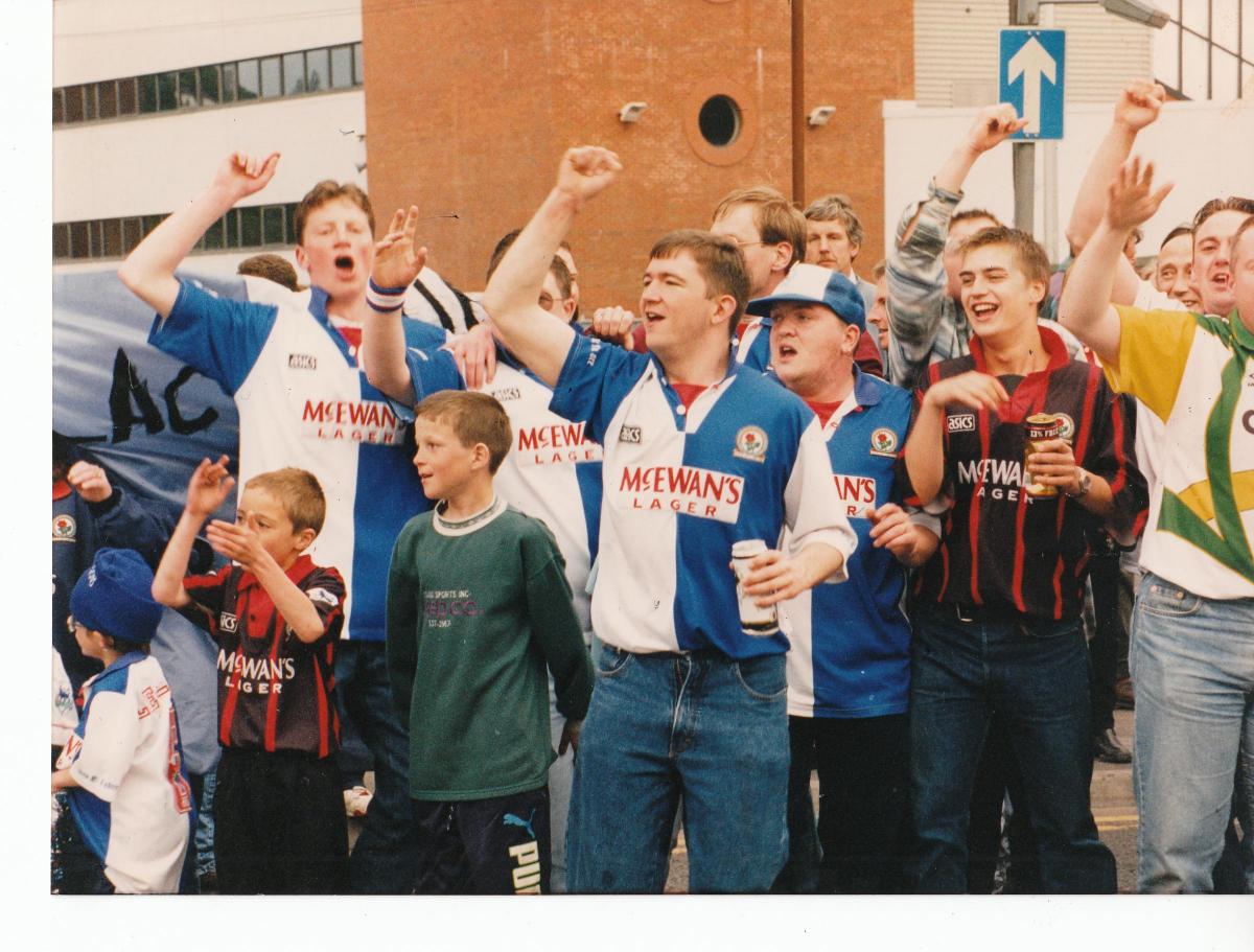 Rovers fans cheer on the supporters in cars at Ewood in 1995.