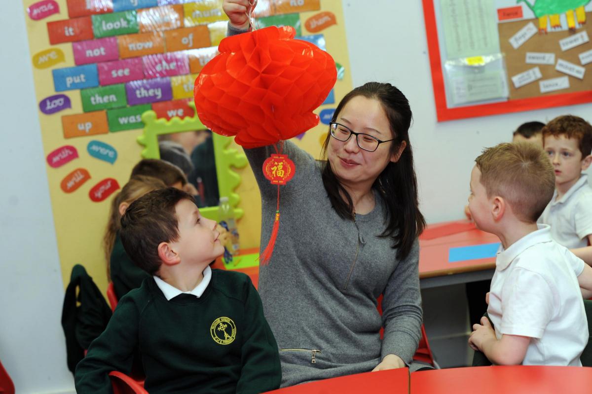 Children in Year 1 and 2 at Padiham Green Primary school take part in Chinese activities in the run up to Chinese New Year and also because the school is linked to a school in Quingdao in China.
L-R are Brandon Kennedy 6, teacher Wenxuan Li and Thomas Wil
