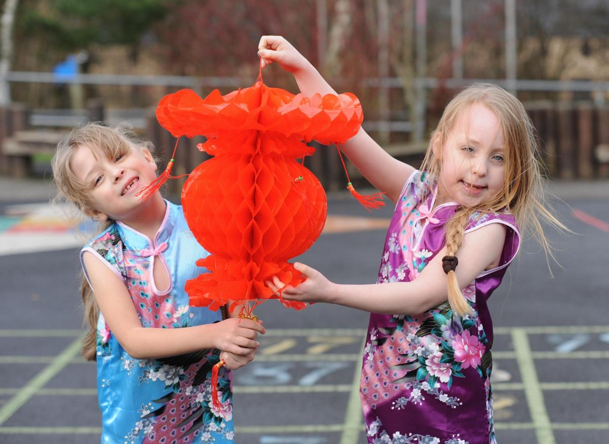 Children in Year 1 and 2 at Padiham Green Primary school take part in Chinese activities in the run up to Chinese New Year and also because the school is linked to a school in Quingdao in China. Pictured are Charlotte Thompson and Olivia McEvoy