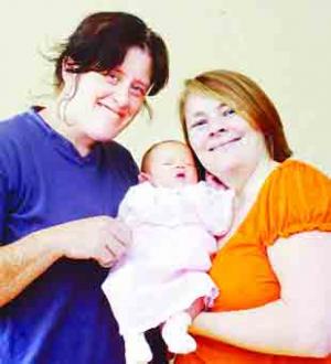 BABY JOY: Mum Cheryl (left) and new-born baby Kelsie with neighbour Tracey