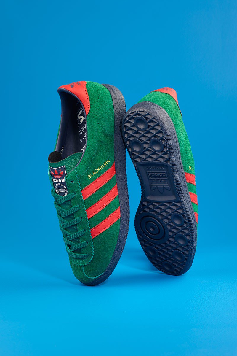 green and red adidas trainers