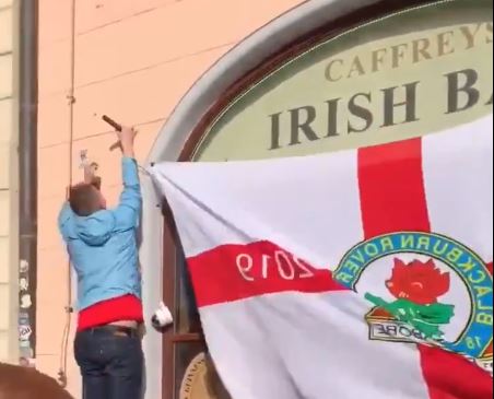 Watch Blackburn Rovers fan try and fail to put up England flag outside Irish pub in Prague