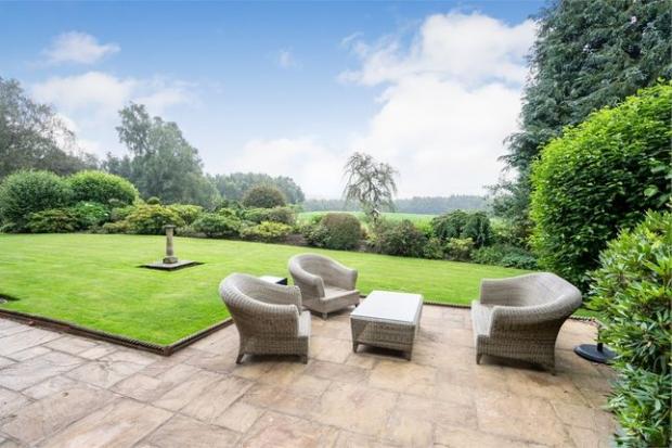 Lancashire Telegraph: The garden has a patio area (Photo: Zoopla, Express Estate Agency)