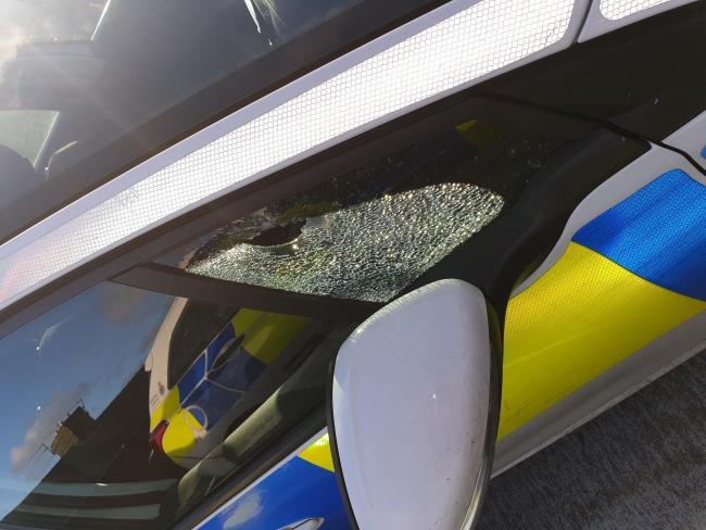 A police car was attacked by youths in Colne 