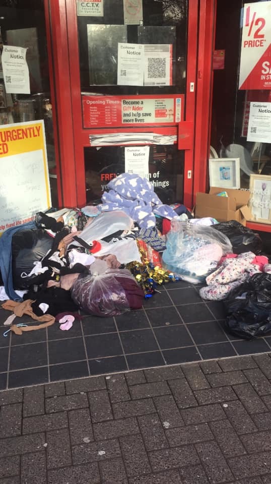 Bags are being left outside the Darwen branch of the British Heart Foundation charity shop - volunteers say people are ignoring the signs and need to stop leaving them there