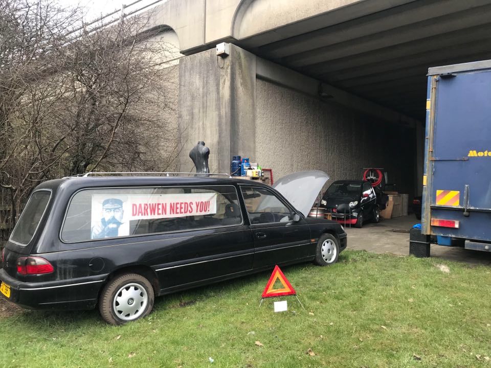 A mystery man has set up home under the motorway bridge at Darwen Services, leaving residents puzzled about why hes chosen that precise location 