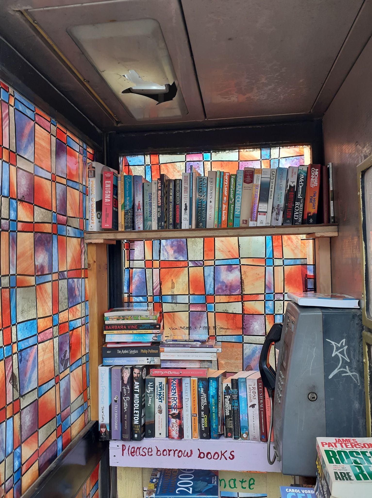 Wayne Dixon has transformed the old phone box in Darwen into a mini library