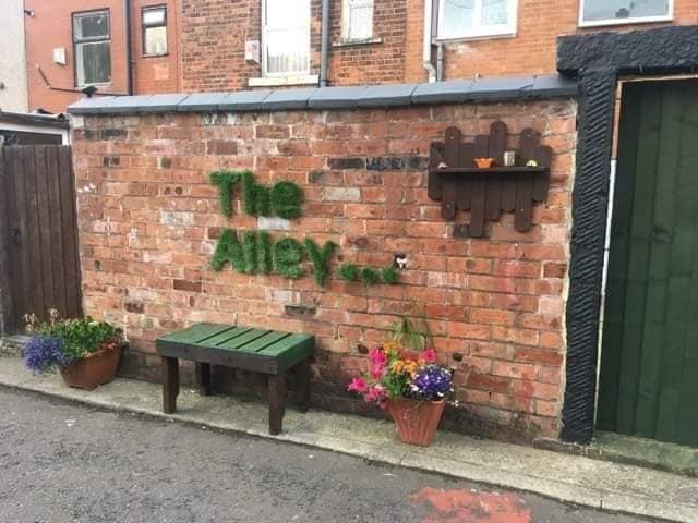 Residents are sprucing up their back alleys in Blackburn and Darwen. Pic: Antony Tabiner