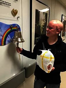 Laura ringing the bell after treatment 