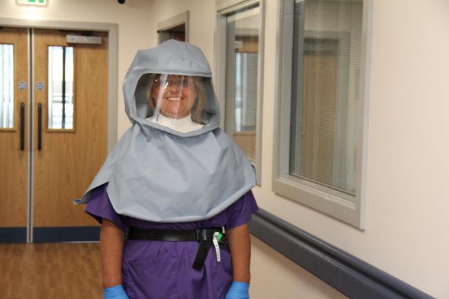 Undated handout photo issued by BAESystems of Matron Sally Young wearing a new full-face protective hood. The defence and aerospace company teamed up with Lancashire-based family-owned firm Lancastle to come up with what has become known as the Morecambe