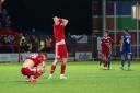 Accrington Stanley's players devastated at the final whistle after losing from 2-0 up