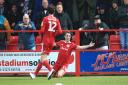 Sean McConville celebrates after scoring his first of the afternoon in the win over Bolton Wanderers