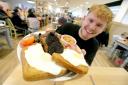 Customer Robert Trigg tries the Morrisons Black Fry-Day breakfast. Photo credit should read: Nigel Roddis/PA Wire