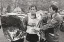 Pete Leviston, of Barrow, is helped by Eric Mitchinson and Alan Dodds of Windermere Rotary Club after finishing second in the 1982 race
