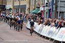 TALK OF THE TOWN: Riders riding through the town centre during the Colne Grand Prix watched by thousands of spectators Pictures: VeloUk