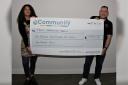 Si Donnelly accepting the Community CVS cheque of £1,992