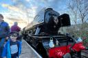 Edward Almond, 3, is following in his great-granddad's footsteps, waving in the Flying Scotsman at Ramsbottom Station