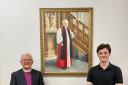 Former Bishop of Blackburn the Rt Rev Julian Henderson (left) and Cathedral Verger Jack Aspinall and the portrait