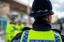 Police arrested two men after reports of thefts from shops in Bolton town centre