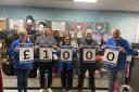 A Burnley company is offering people the chance to win £1000 and support their local hospital.
