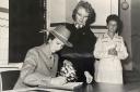 Princess Anne signs the visitors' book and a commemorative photograph at Blackburn Infirmary in October 1980