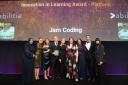 Jam Coding collecting their award from Claudia Winkleman
