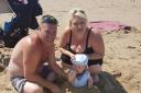 Vincent McDonagh pictured at the beach with his fiance Demis Leigh Sykes and their child Frankie
