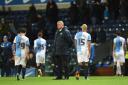 Rovers players cut dejected figures following the late loss to the Owls