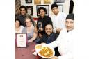 Pictured L-R: (back row): Alkas Ali, Faz Ahmed, Hussain Ali; (front row): Laura Jackson (customer), Victoria Sedgwick (customer), Ibby Ali (owner) Esof Ali (chef).