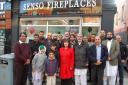 Abdul Ghaffar (back row fourth from left) of Sensi Fireplaces with Kate Hollern MP and local councillors outside the new business on Darwen St, Blackburn