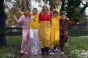 Pupils and staff from worsthorne Primary School do their bit for Children In Need. Year 6 teaching assistant Jane Pier with pupils Charley Smith, Madison Larnach, Alyssa Sharples and Keane Darcy, walking in onesies.