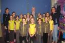 The Brownies and leaders present a cheque to Mayor Cllr James Starkie