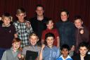 Footballers from St Francis Primary School, Blackburn, receive their award from former Rovers star Kevin Gallacher