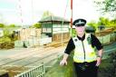 RESCUE: PC John Fisher pulled the girl over the barrier at Moseley Road crossing